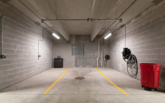 a large storage room with a red bucket in the middle of it