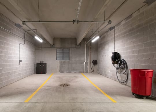 a large storage room with a red bucket in the middle of it