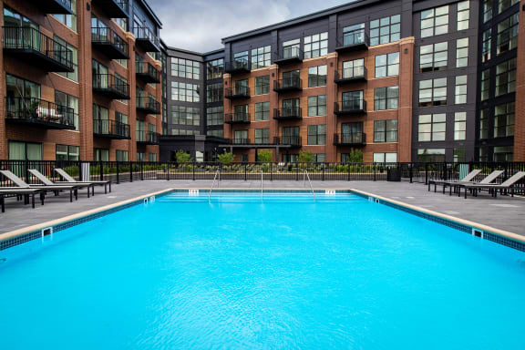 a swimming pool in front of a building