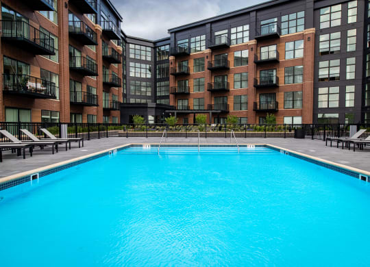 a swimming pool in front of a building